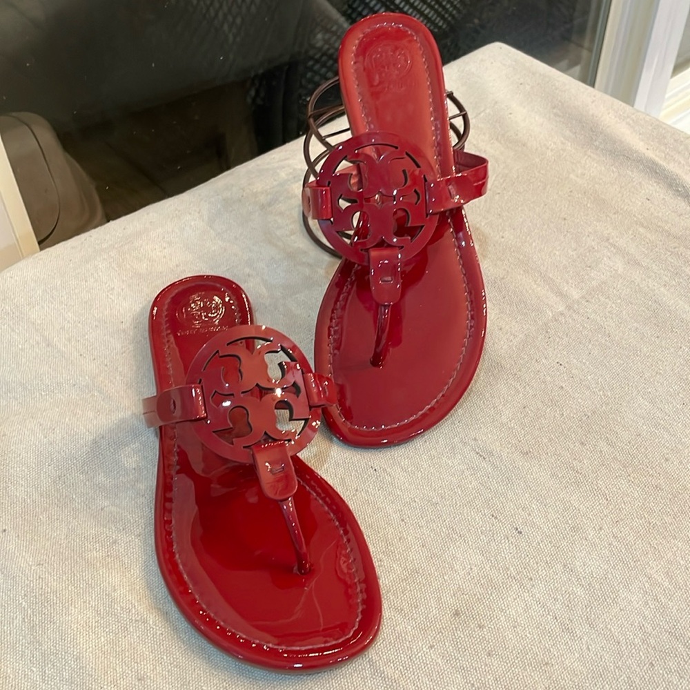 Tory Burch Dark Red Patent Leather Miller Sandals.